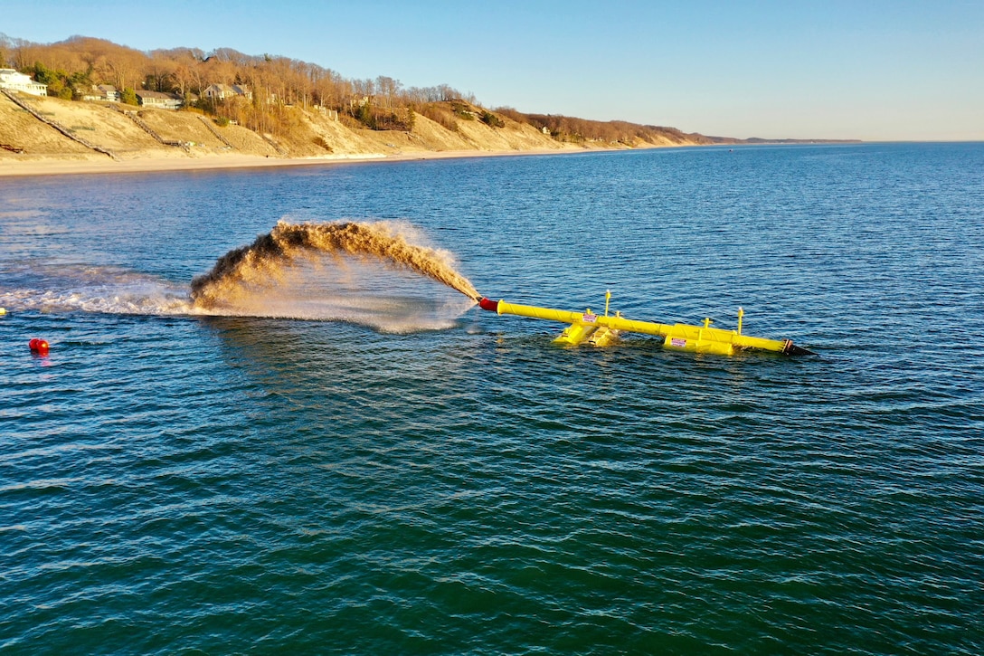Annual U.S. Army Corps of Engineers, Detroit District maintenance dredging operations are scheduled to begin Friday, June 13, in the federal channel at outer Grand Haven Harbor, Michigan. The maintenance dredging will use a hydraulic dredging to place sediment in the nearshore area almost a mile south of the Grand Haven south pier to renourish eroded areas. (U.S. Army Corps of Engineers file photo.)