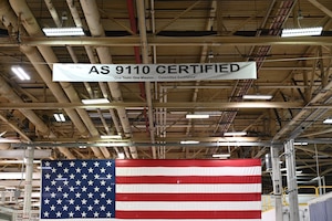 White banner displayed on top of the American flag