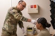 Army Reserve Staff Sgt. Genaro Oxford, a combat medic assigned to the Red Rock, Ariz., based 7220th Medical Support Unit, uses a thermometer to check the vitals of another Soldier during Exercise Global Medic and Mojave Falcon 2025 in Fort Hunter Liggett, Calif., June 7, 2025. Approximately 70 Soldiers of the 7220th MSU provided real-world medical services and support to more than 1,000 service members who took part in the combined training exercises, from May 28, 2025, through June 11, 2025. (U.S. Army Reserve photo by Sgt. 1st Class Christopher Hernandez)
