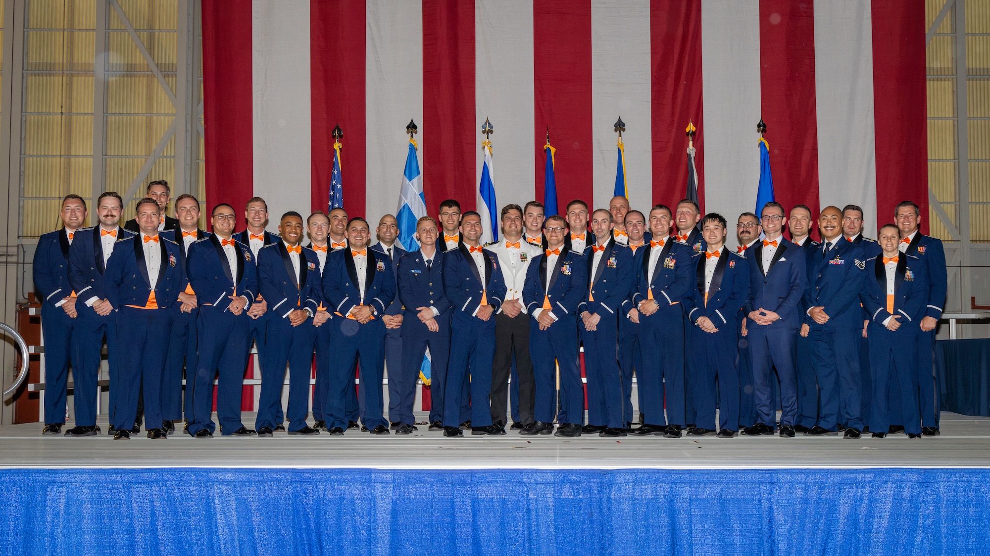 Students from Air Force Test Pilot School class 24-Bravo pose for a final class photo during graduation ceremonies held at Edwards Air Force Base, CA on June 7, 2025. Class 24B is the second fully integrated air and space course under modernized multi-domain curriculum. (Air Force photo by Brandon Herandez)