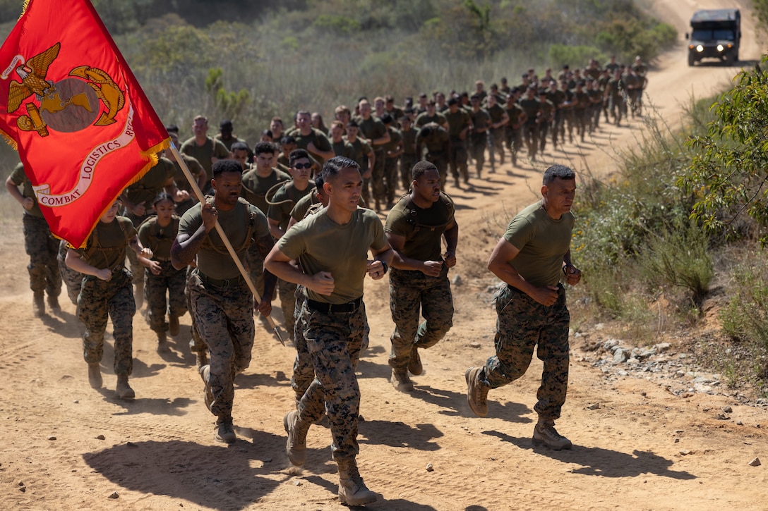 U.S. Marines and Sailors with Combat Logistics Regiment 1, 1st Marine Logistics Group, participate in a regimental run during a Reckless Rodeo event on Camp Pendleton, California, May 22, 2025.