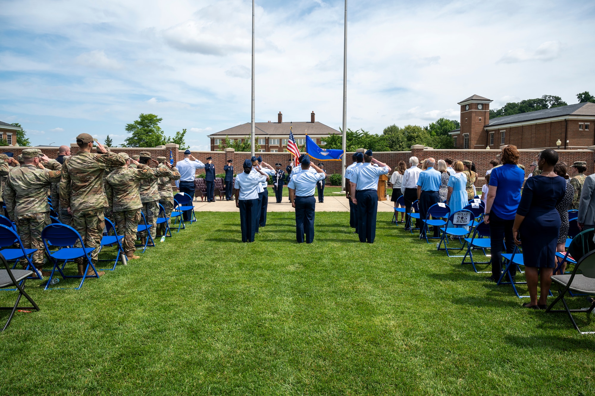 U.S. Airmen and members of the audience stand for the playing of “The Star-Spangled Banner” during the 794th Communications Squadron change of command ceremony at Joint Base Anacostia-Bolling, Washington, D.C., June 10, 2025. During the command of U.S. Air Force Lt. Col. Daniel P. Boyarski, the 794th CS provided individual and unit customer support, information technology service management functions and improvements to joint basing information enterprise service functions. (U.S. Air Force photo by Hayden Hallman)