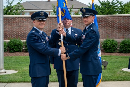 From right, U.S. Air Force Lt. Col. Daniel P. Boyarski, 794th Communications Squadron outgoing commander, relinquishes command to Col. Patrick D. Rienzi, 844th Communications Group commander, during the 794th CS change of command ceremony at Joint Base Anacostia-Bolling, Washington, D.C., June 10, 2025. During Boyarski’s command, the 794th CS provided communication services to the 11th Wing and approximately 70 tenant organizations. (U.S. Air Force photo by Hayden Hallman)