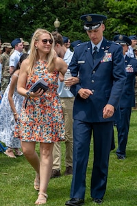 U.S. Air Force Lt. Col. Jeffrey P. Pelkey, 794th Communications Squadron incoming commander, walks with his wife following the 794th CS change of command ceremony at Joint Base Anacostia-Bolling, Washington, D.C., June 10, 2025. Pelkey previously served as the branch chief of 17D Talent Management, Headquarters Air Force at the Pentagon. (U.S. Air Force photo by Hayden Hallman)