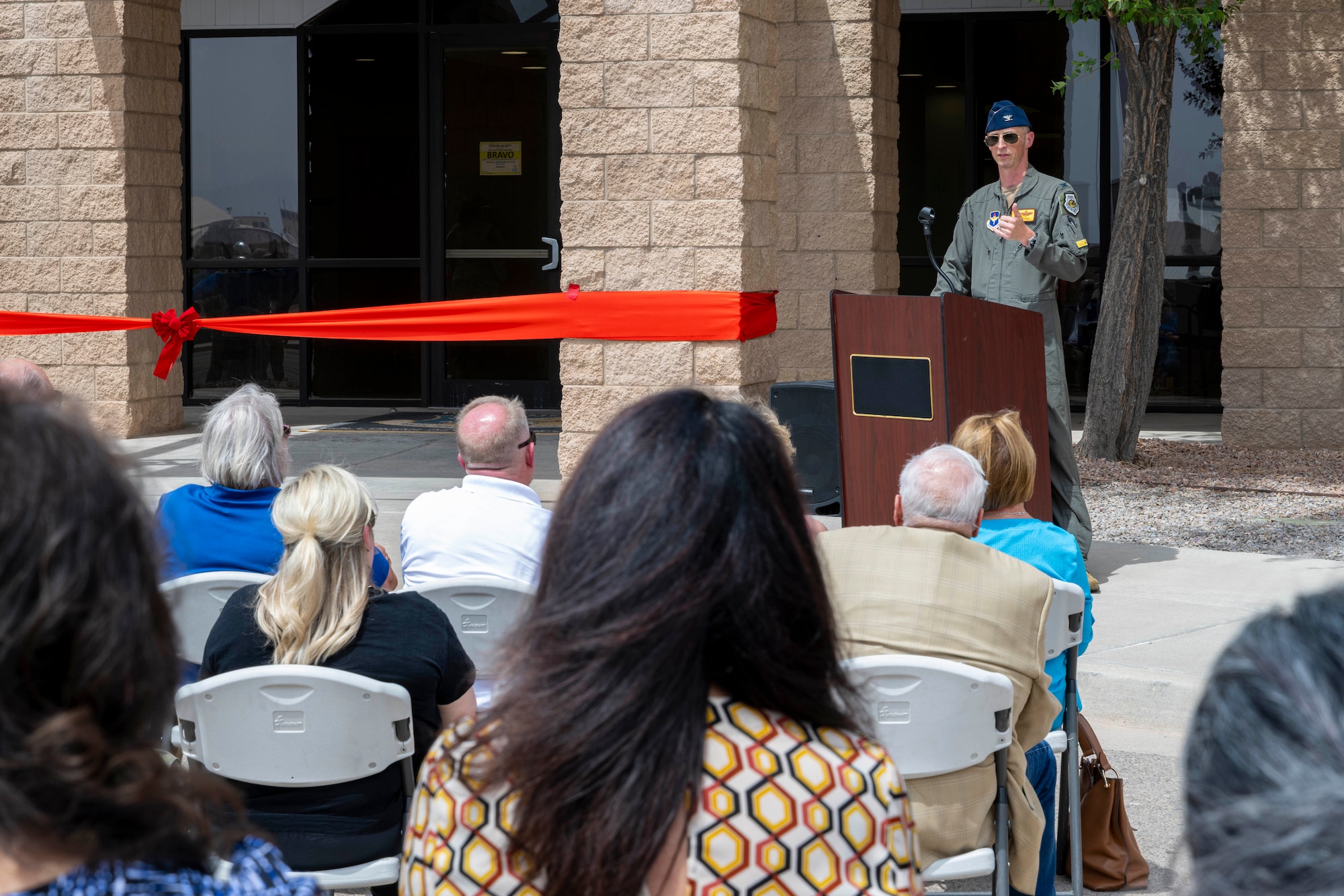U.S. Air Force Col. Brad Howell, 49th Operations Group commander, gives opening remarks during a ribbon cutting ceremony for the 49th OG new facility at Holloman Air Force Base, New Mexico, May 30, 2025.