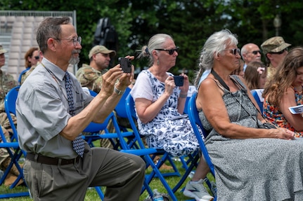 Retired U.S. Air Force Lt. Col. David P. Boyarski and Jane Boyarski record their son, Lt. Col. Daniel P. Boyarski, 794th Communications Squadron outgoing commander, during the 794th CS change of command ceremony at Joint Base Anacostia-Bolling, Washington, D.C., June 10, 2025. During Boyarski’s command, the 794th CS led the way for multiple upgrades and renovations to JBAB’s communications infrastructure to ensure the continuation and modernization of critical IT support. (U.S. Air Force photo by Hayden Hallman)