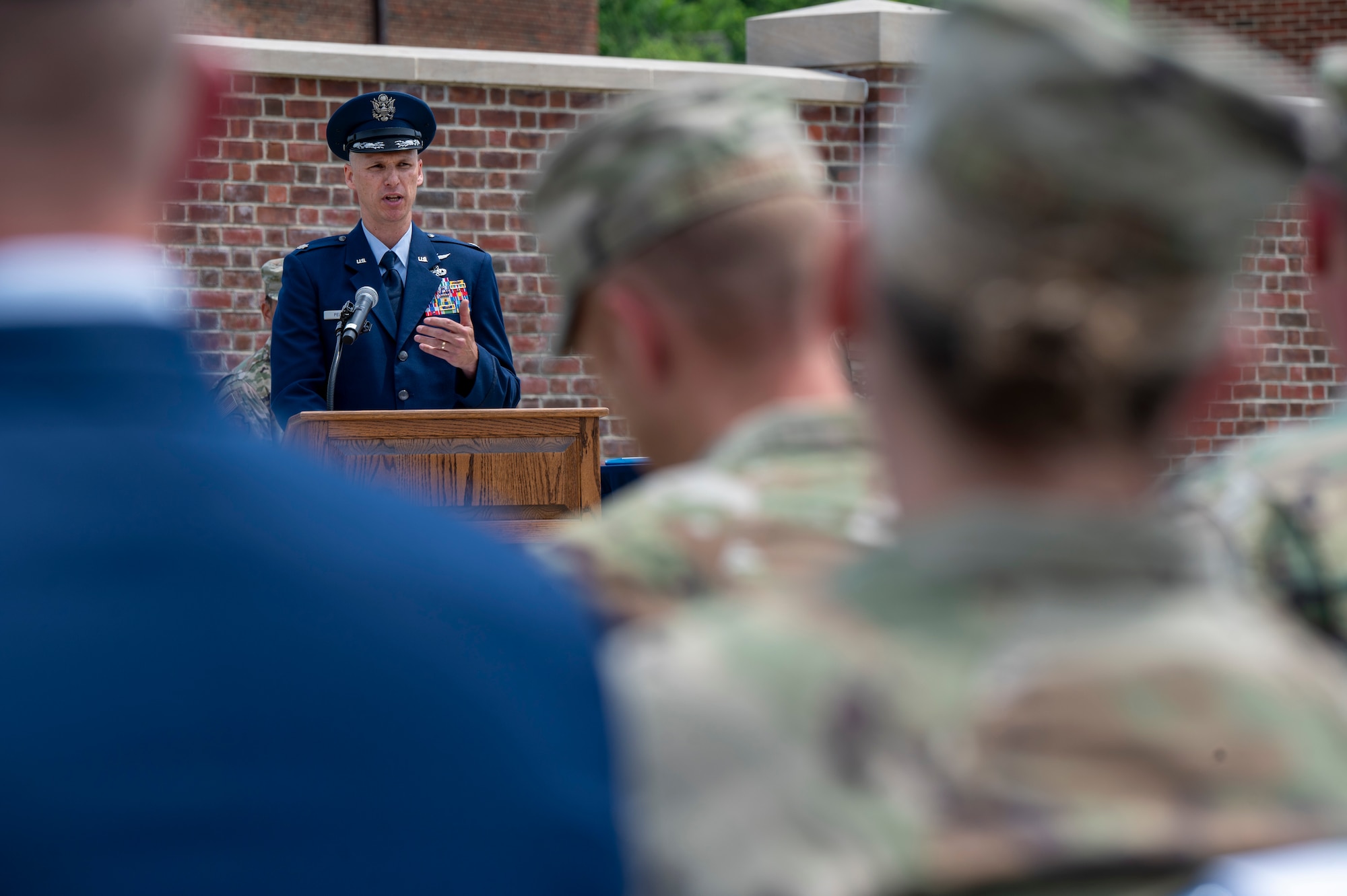 U.S. Air Force Lt. Col. Jeffrey P. Pelkey, 794th Communications Squadron incoming commander, speaks to an audience of Airmen and family members during the 794th CS change of command ceremony at Joint Base Anacostia-Bolling, Washington, D.C., June 10, 2025. Pelkey assumed command of the 794th CS, which maintains vital communications infrastructure used by approximately 70 agencies on JBAB. (U.S. Air Force photo by Hayden Hallman)