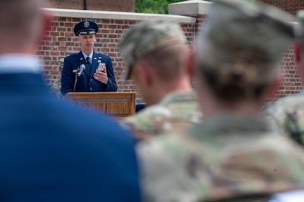U.S. Air Force Lt. Col. Jeffrey P. Pelkey, 794th Communications Squadron incoming commander, speaks to an audience of Airmen and family members during the 794th CS change of command ceremony at Joint Base Anacostia-Bolling, Washington, D.C., June 10, 2025. Pelkey assumed command of the 794th CS, which maintains vital communications infrastructure used by approximately 70 agencies on JBAB. (U.S. Air Force photo by Hayden Hallman)