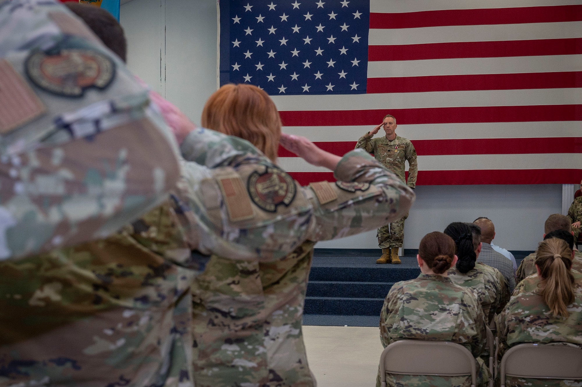 Lt. Col. Thomas Naughton, 319th Healthcare Operations Squadron out-going commander, renders a final salute to his airmen during the 319th HCOS change of command ceremony at Grand Forks Air Force Base, N.D., June 10, 2025.