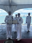 Rear Adm. Hiigel, deputy commander for Coast Guard Pacific Area, presented an award to Capt. Scott Wolland during the change of command ceremony for U.S. Coast Guard Reserve Unit at the United States Indo-Pacific Command (CGRU USINDOPACOM), June 12, 2025, in Honolulu. CGRU USINDOPACOM is a unique joint unit, in which members are integrated throughout the U.S. Indo-Pacific combatant command, providing leadership, expertise, and support to the joint force. (U.S. Coast Guard courtesy photo)