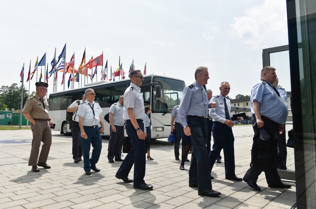Attendees of the NATO Air Force Chaplains Consultative Committee Conference arrive at Allied Air Command headquarters, Ramstein Air Base, Germany, June 10, 2025. Military chaplains from 12 NATO and partner nations across Europe convened at Ramstein for a conference to wargame how they might operate together in future conflicts. (U.S. Air Force photo by Capt. Cameron Silver)