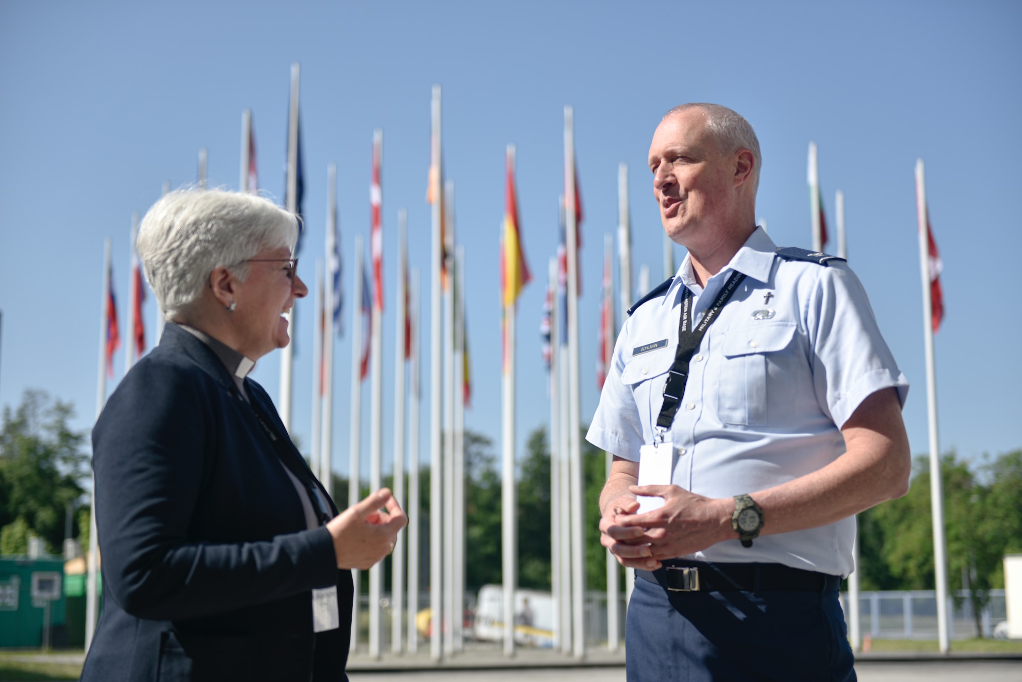 Dr. Alexandra Dierks, senior chaplain in the German Army, left, shares a laugh with U.S. Air Force Chaplain (Col.) Brian Bohlman, Air National Guard, while on break during the NATO Air Force Chaplains Consultative Committee Conference, Ramstein Air Base, Germany, June 12, 2025. Military chaplains from 12 NATO and partner nations across Europe convened at Ramstein for a conference to wargame how they might operate together in future conflicts. (U.S. Air Force photo by Capt. Cameron Silver)