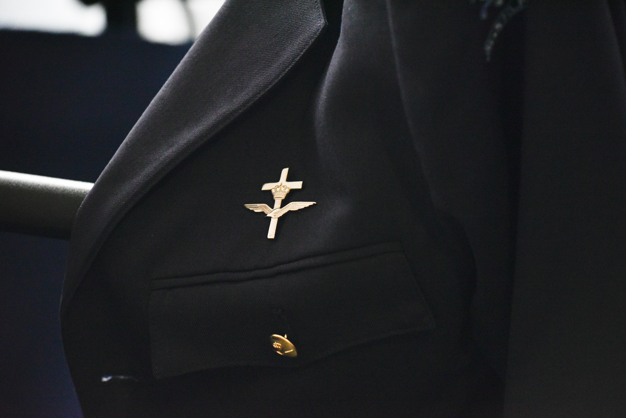 An attendee’s coat rests on a chair at the NATO Air Force Chaplains Consultative Committee Conference, Ramstein Air Base, Germany, June 10, 2025. Military chaplains from 12 NATO and partner nations across Europe convened at Ramstein for a conference to wargame how they might operate together in future conflicts. (U.S. Air Force photo by Capt. Cameron Silver)