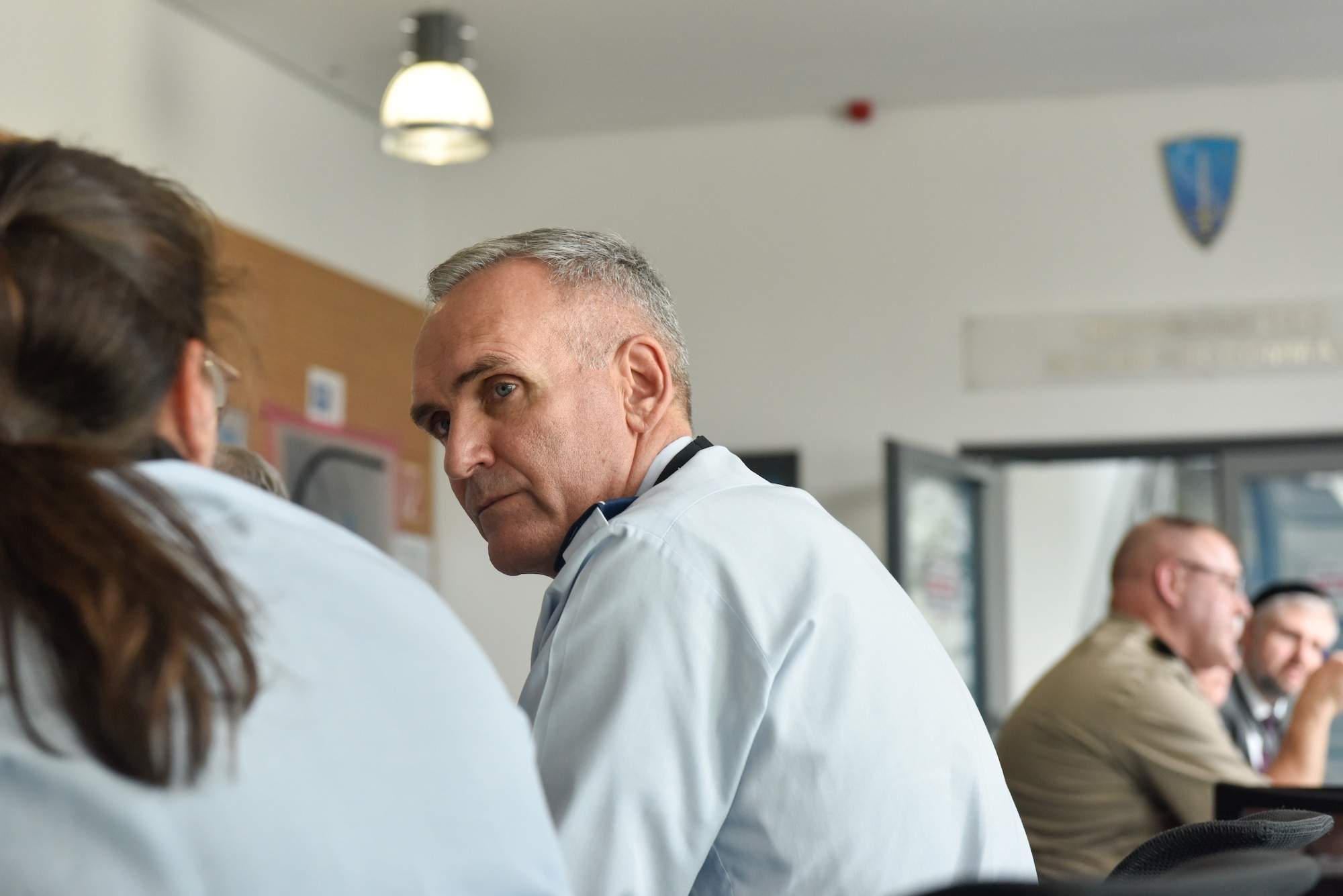 Chaplain (Col.) Kleet Barclay, U.S. Air Forces in Europe-Air Forces Africa Command Chaplain, listens during a tabletop exercise at the NATO Air Force Chaplains Consultative Committee Conference, Ramstein Air Base, Germany, June 10, 2025. Military chaplains from 12 NATO and partner nations across Europe convened at Ramstein for a conference to wargame how they might operate together in future conflicts. (U.S. Air Force photo by Capt. Cameron Silver)