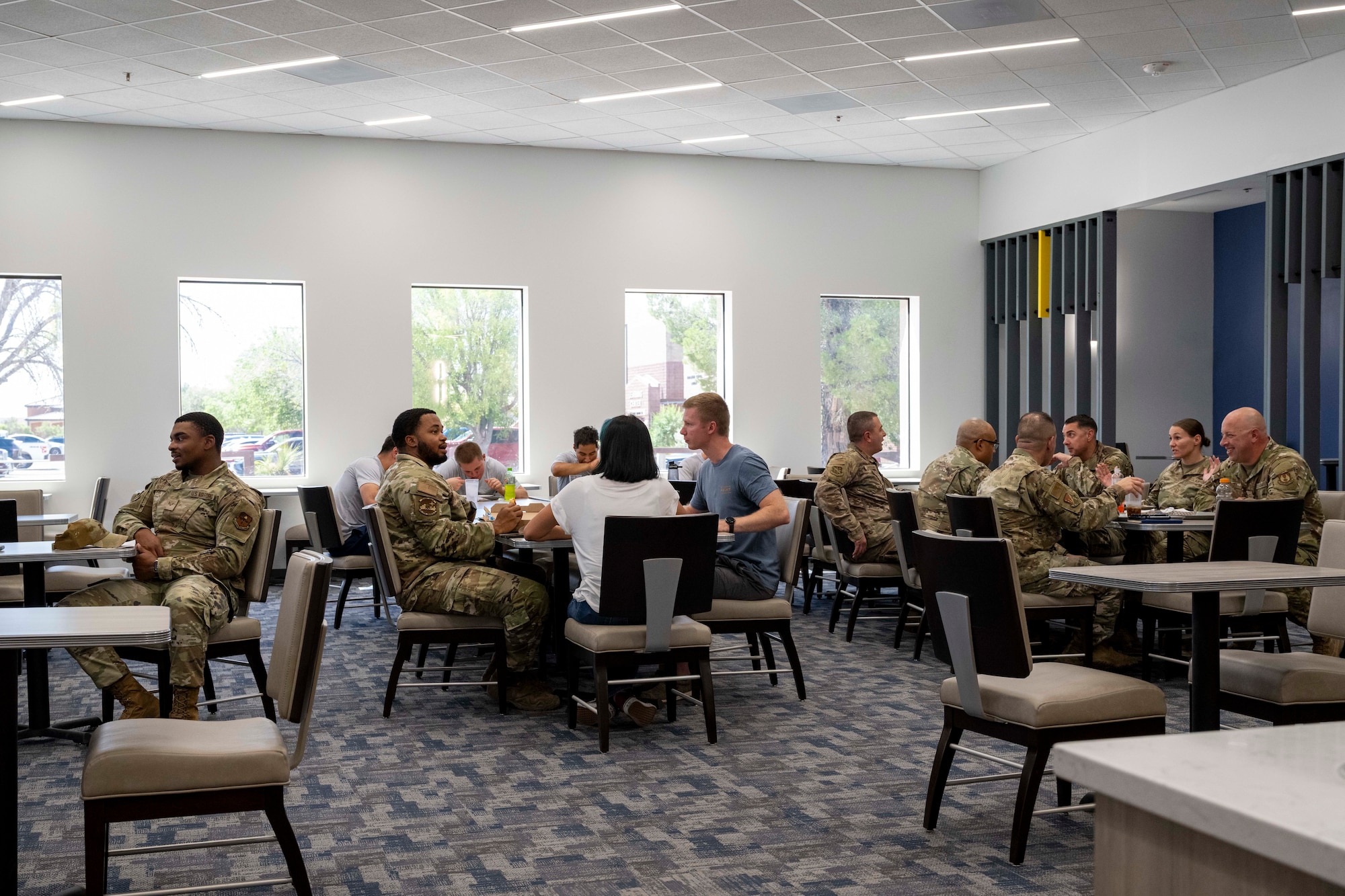 Team Holloman members eat during the Shifting Sands Dining Facility grand reopening ceremony at Holloman Air Force Base, New Mexico, June 12, 2025.