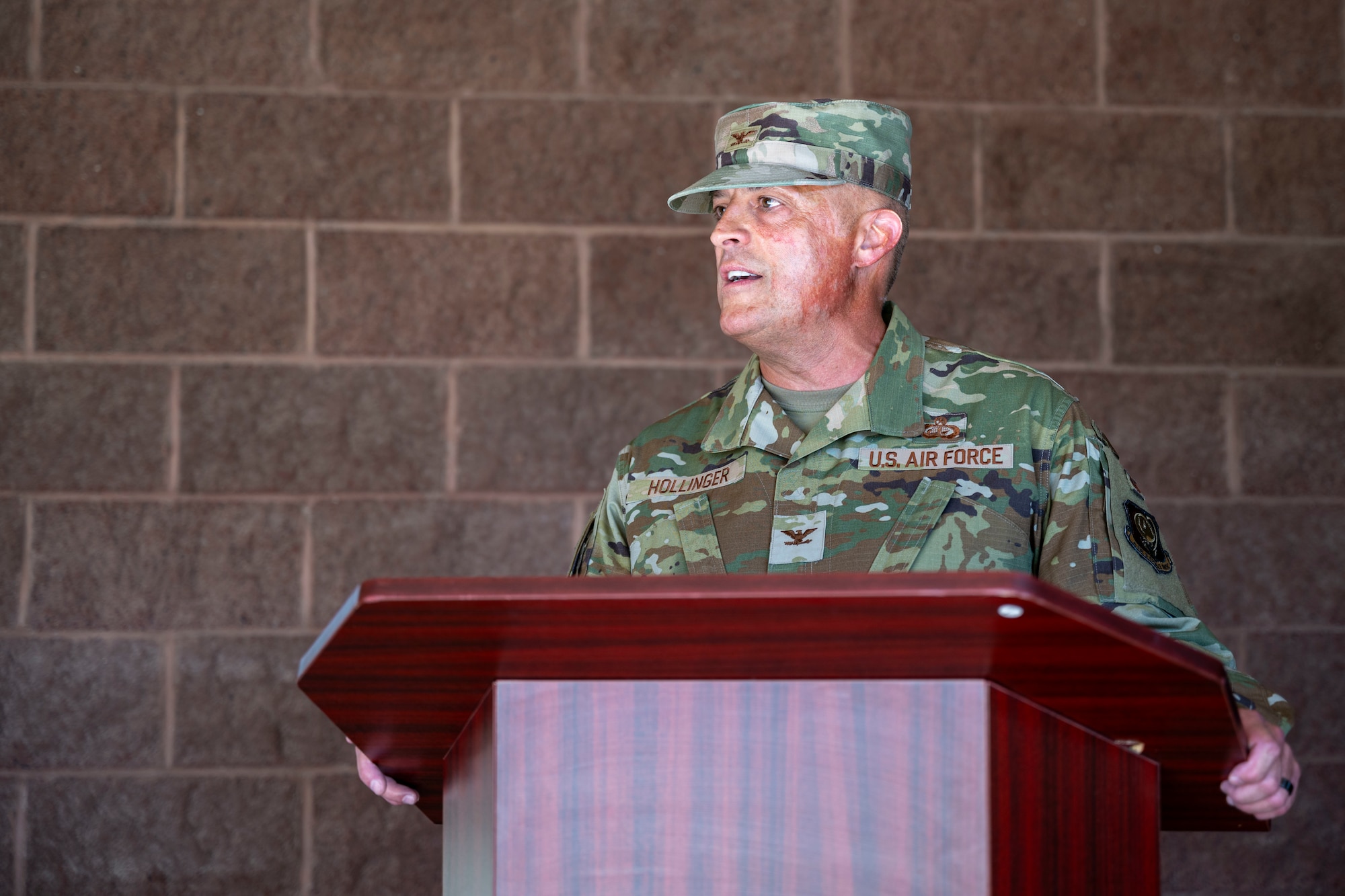 U.S. Air Force Col. Chip Hollinger, Air Force Services Center director of mission operations, gives opening remarks during the Shifting Sands Dining Facility grand reopening ceremony at Holloman Air Force Base, New Mexico, June 12, 2025.