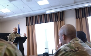 Command Chief Master Sgt. Travon Dennis, Fourth Air Force Command Chief, addresses First Sergeants from various Reserve Command units during a week-long symposium at Niagara Falls Air Reserve Station, New York, June 9, 2025.