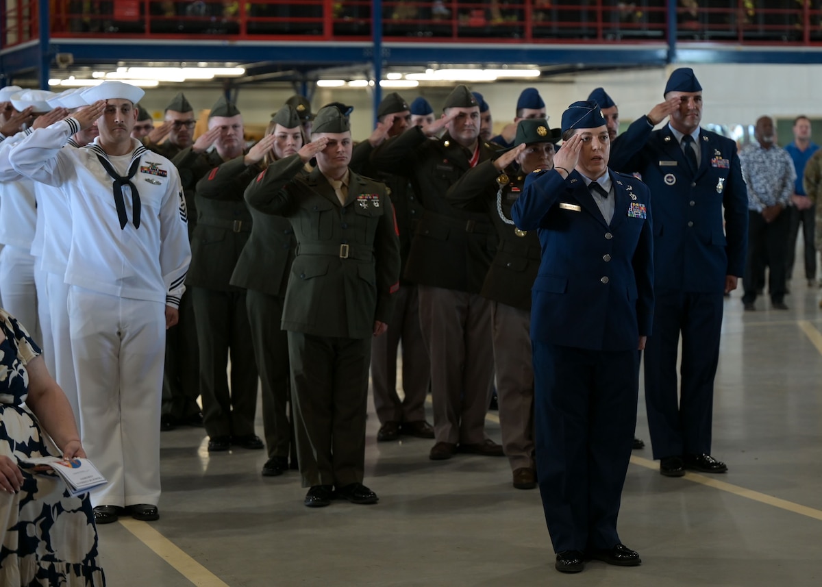 U.S. service members assigned to the 312th Training Squadron present a final salute to Lt. Col. Brandon DeLong, outgoing 312th TRS commander, at the Louis F. Garland Department of Defense Fire Academy, Goodfellow Air Force Base, Texas, June 12, 2025. The salute represents the squadron saying farewell to their previous commander. (U.S. Air Force photo by Senior Airman Evelyn J. D’Errico)