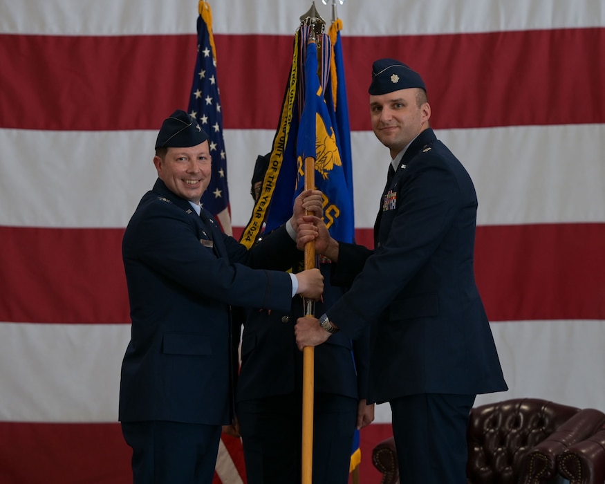 U.S. service members assigned to the 312th Training Squadron present a final salute to Lt. Col. Brandon DeLong, outgoing 312th TRS commander, at the Louis F. Garland Department of Defense Fire Academy, Goodfellow Air Force Base, Texas, June 12, 2025. The salute represents the squadron saying farewell to their previous commander. (U.S. Air Force photo by Senior Airman Evelyn J. D’Errico)
