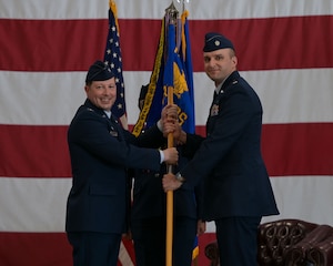 U.S. service members assigned to the 312th Training Squadron present a final salute to Lt. Col. Brandon DeLong, outgoing 312th TRS commander, at the Louis F. Garland Department of Defense Fire Academy, Goodfellow Air Force Base, Texas, June 12, 2025. The salute represents the squadron saying farewell to their previous commander. (U.S. Air Force photo by Senior Airman Evelyn J. D’Errico)