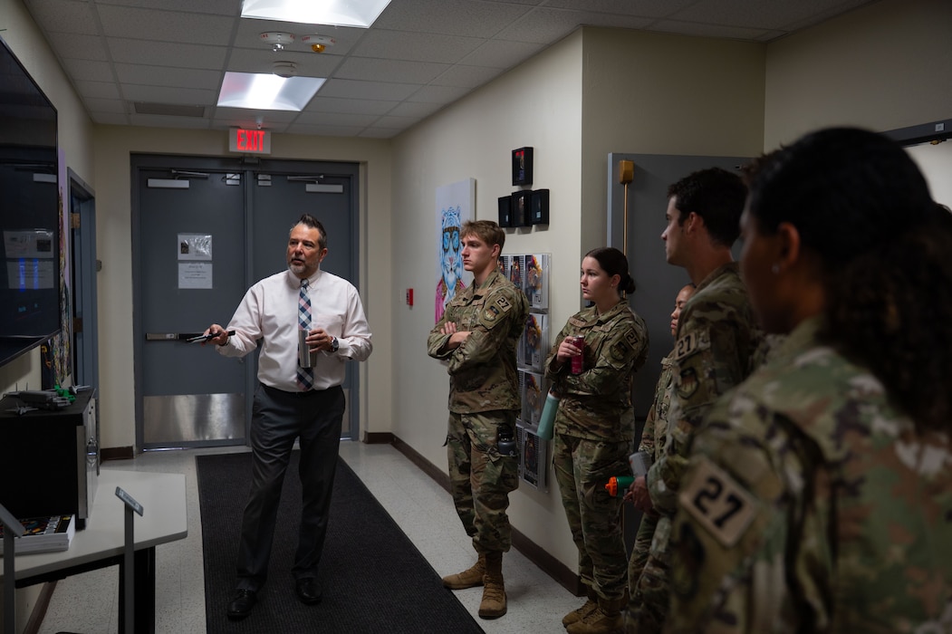 Paul Jackson, Information Technology Unit flight director, briefs cadets from the U.S. Air Force Academy on how the 17th Training Support Squadron is modernizing training for the students attached to the 17th Training Wing during the 17th TRSS tour at Goodfellow Air Force Base, Texas, June 4, 2025. The 17th TRSS mission is to support the training and education of joint and coalition firefighters along with future intelligence, surveillance and reconnaissance warriors. (U.S. Air Force photo by Airman 1st Class Brian Lummus)