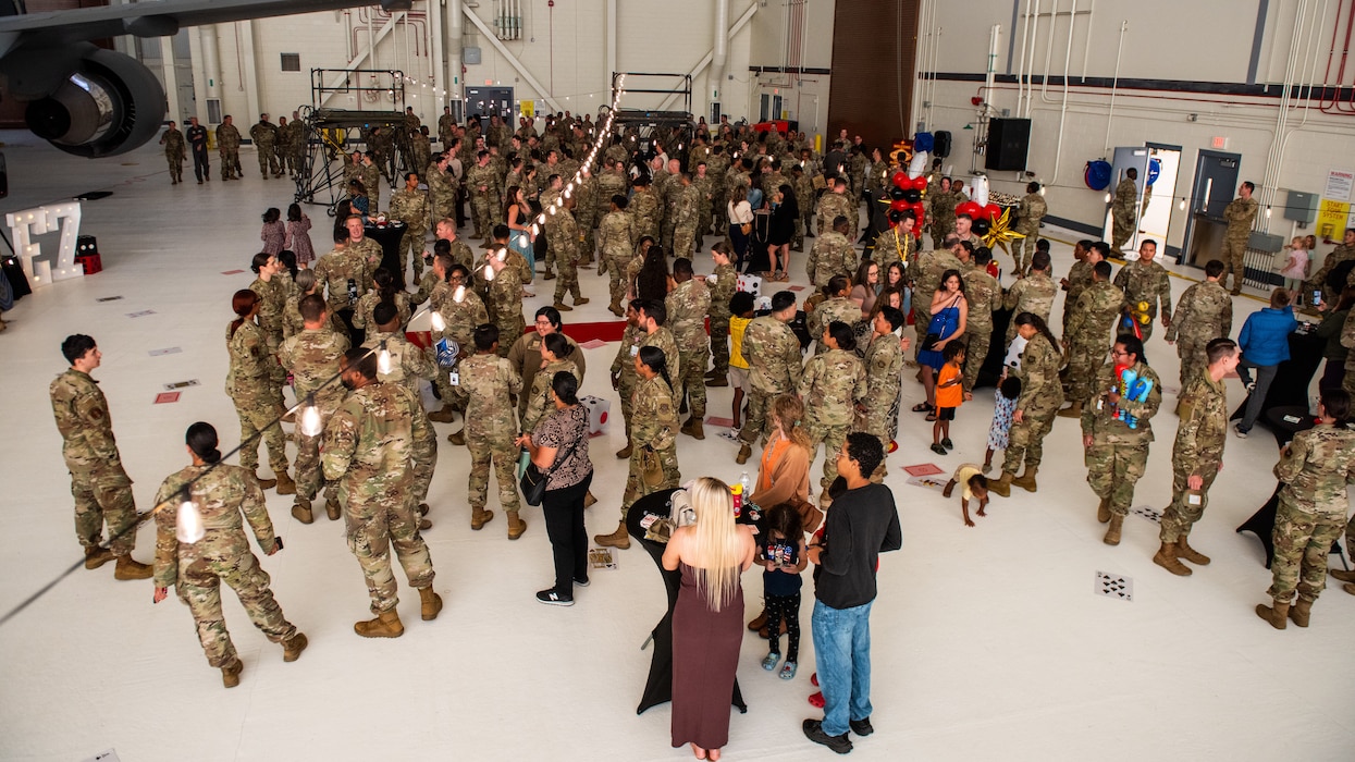 Airmen and family members gathered in hangar