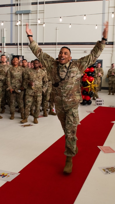 Airman runs to stage through crowd