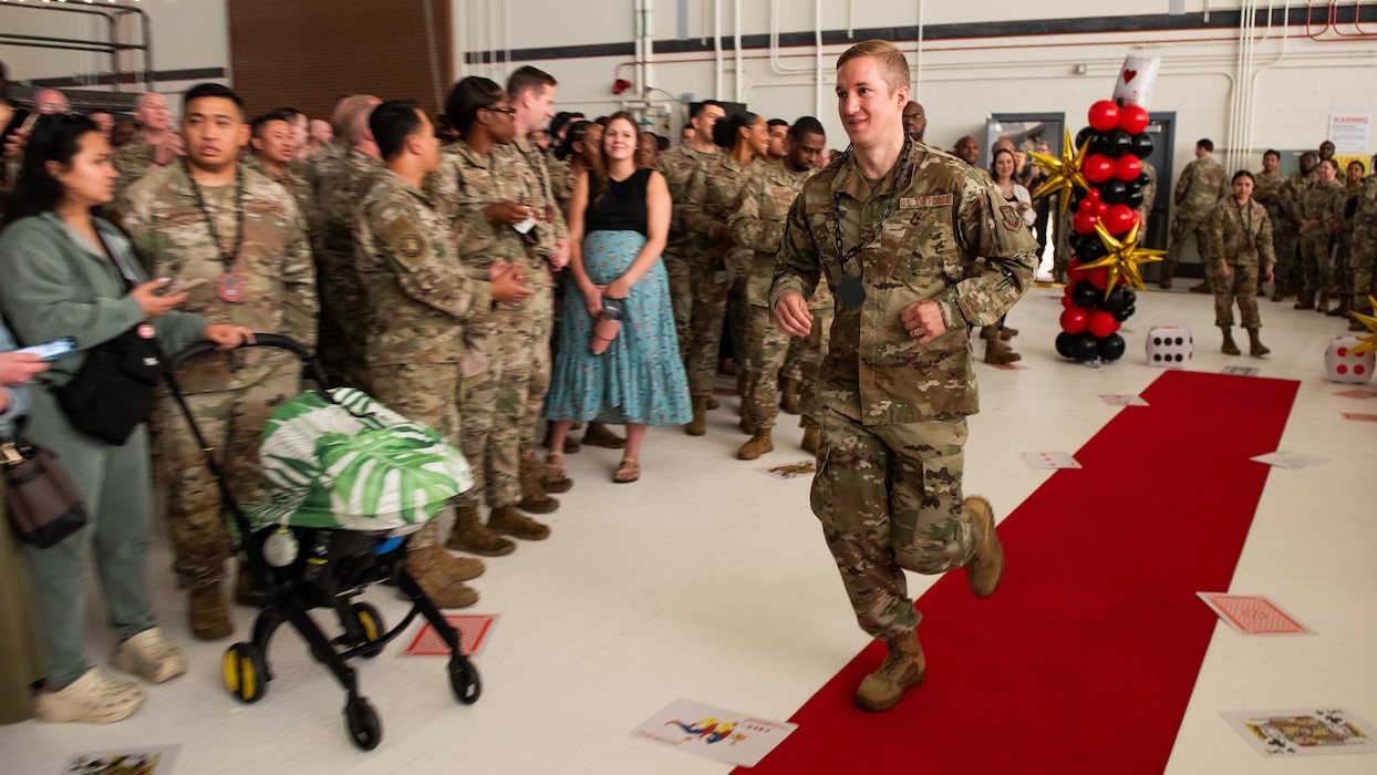 Airman runs to stage through crowd