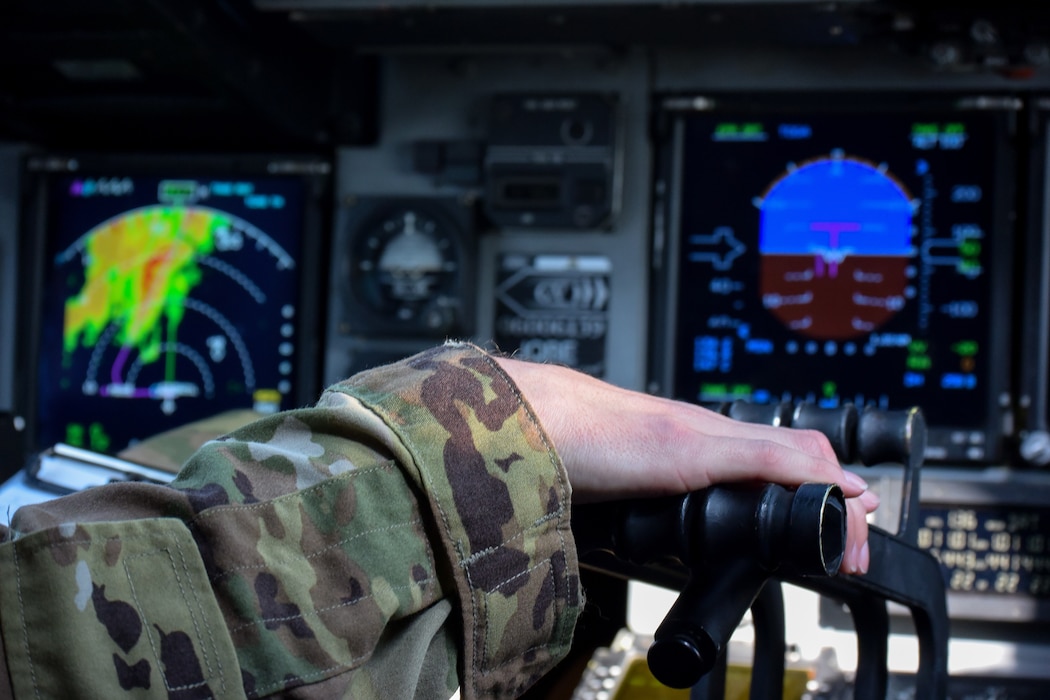 An airman controls the speed of an aircraft as it prepares to depart