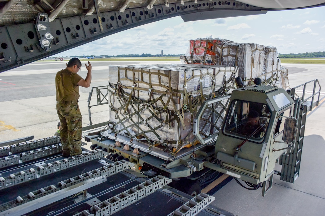 Airman directs cargo on to aircraft