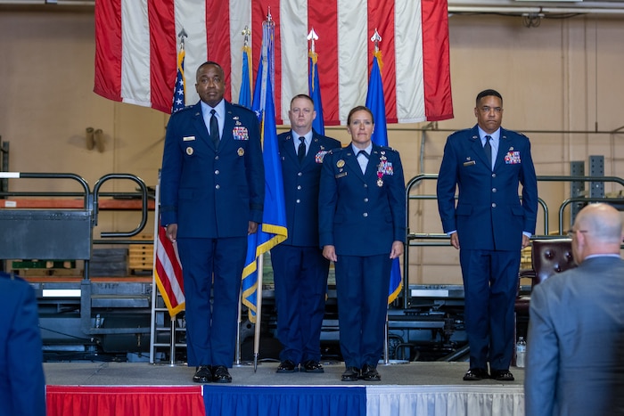 Four people on stage.
