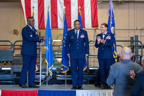 3 people on stage.