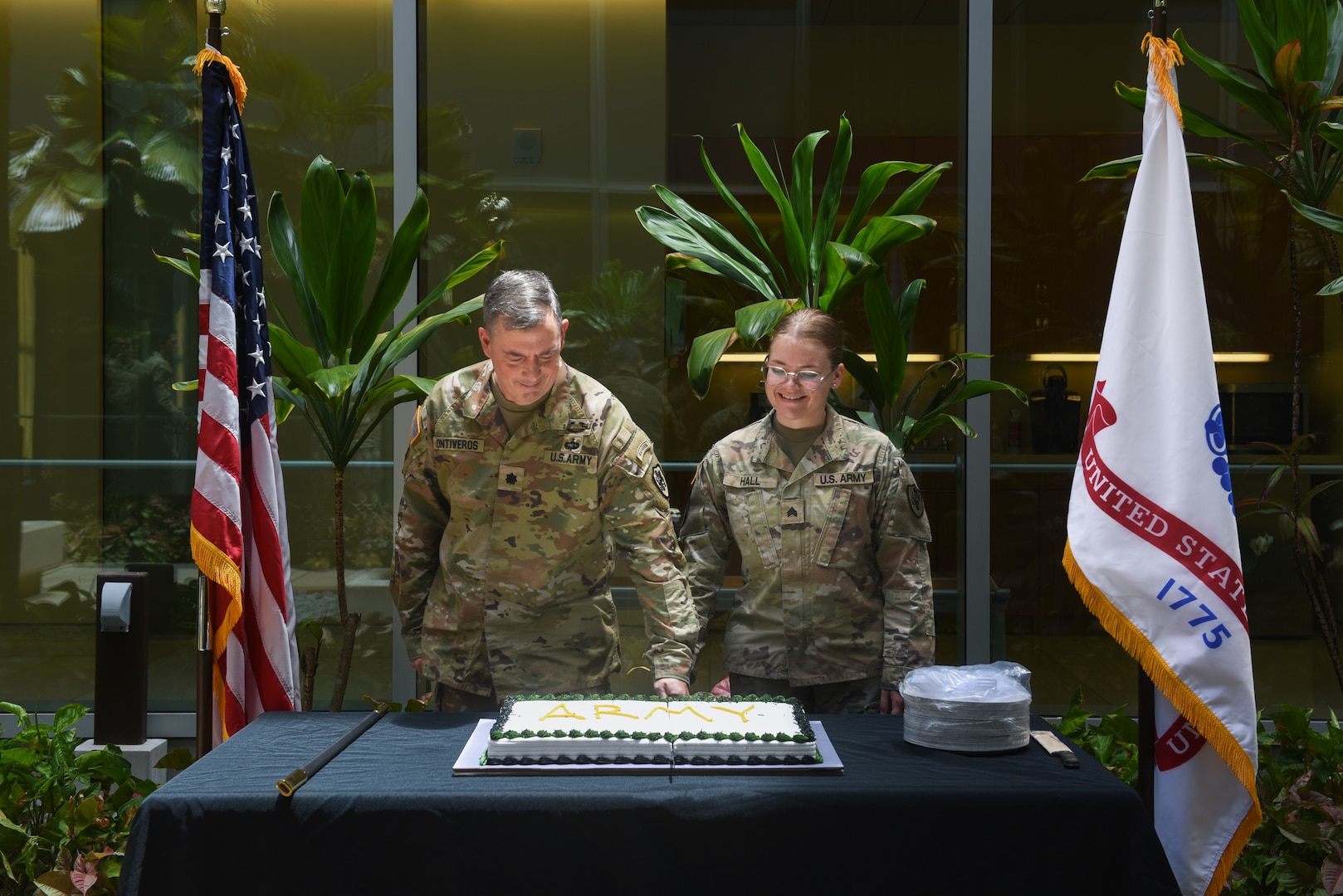 Lt. Col Sean Ontiveros, (left) director of expeditionary support and Sgt. Annabelle Hall, mortuary affairs specialist assigned to the Defense POW/MIA Accounting Agency, cut the cake during the 250th Army Birthday cake cutting ceremony held on Joint Base Pearl Harbor-Hickam, Hawaii, June 13, 2025. The ceremony was held to commemorate the Army's birthday honoring 250 years of rich history and defense of the nation. (U.S. Army Photo by Sgt. Anthony Todd)