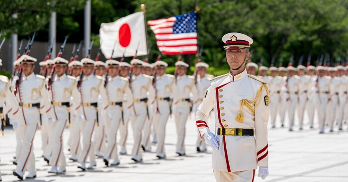 Japanese troops perform honor duties to welcome Air Force Gen. Randall Reed, commander of U.S. Transportation Command, to Japan’s Ministry of Defense in Tokyo, Japan, June 6, 2025.