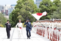 Japanese troops perform honor duties to welcome Air Force Gen. Randall Reed, commander of U.S. Transportation Command, to Japan’s Ministry of Defense in Tokyo, Japan, June 6, 2025.