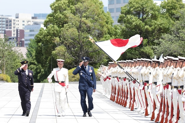 Japanese troops perform honor duties to welcome Air Force Gen. Randall Reed, commander of U.S. Transportation Command, to Japan’s Ministry of Defense in Tokyo, Japan, June 6, 2025.