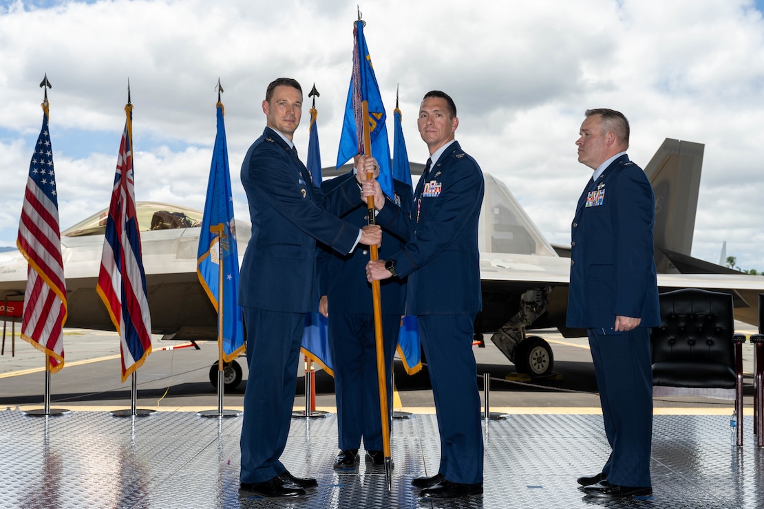 U.S. Air Force commander passes the guidon signifying the end of his time as commander.