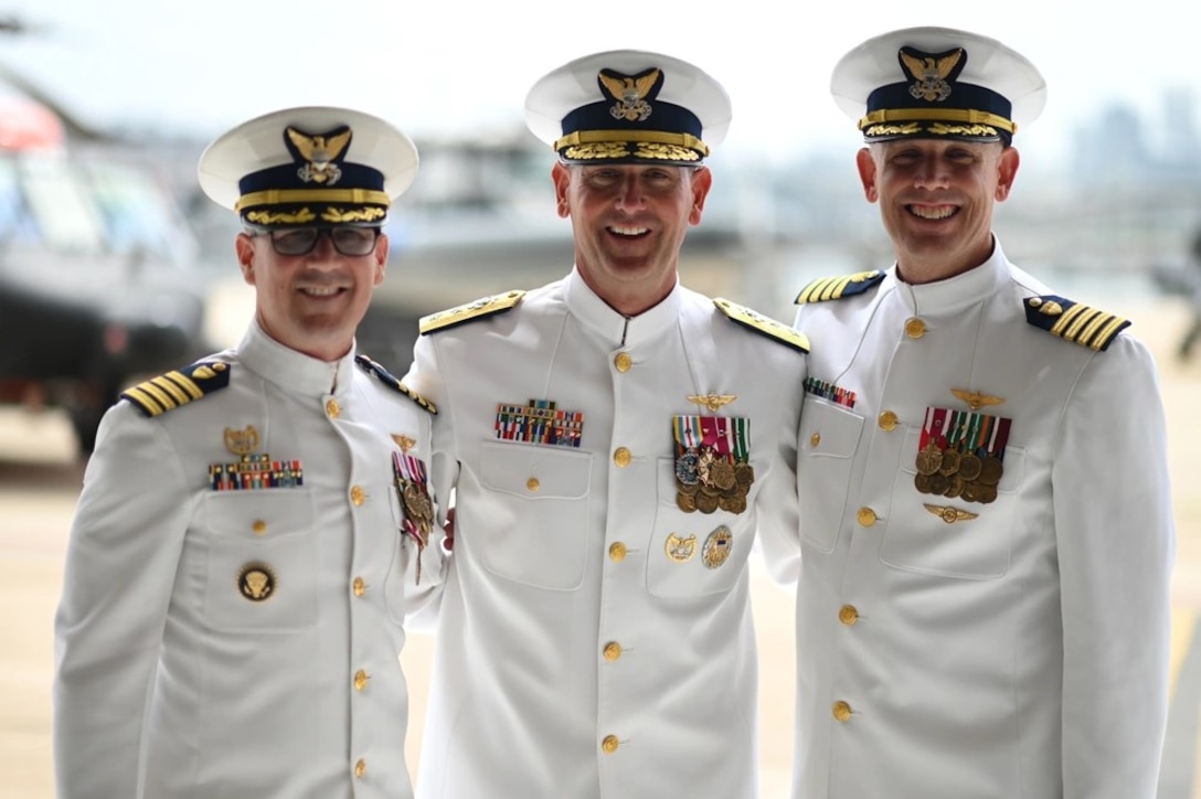 Capt. Robert Tucker relieves Capt. Patrick Dill as the Coast Guard Sector San Diego commander during a change of command ceremony in San Diego, June 13, 2025. Rear Adm. Joseph Buzzella, the 11th Coast Guard District commander, presided over the time-honored military tradition that represents a formal transfer of authority and responsibility for a unit from one commanding officer to another. (U.S. Coast Guard photo by Petty Officer 1st Class Adam Stanton)