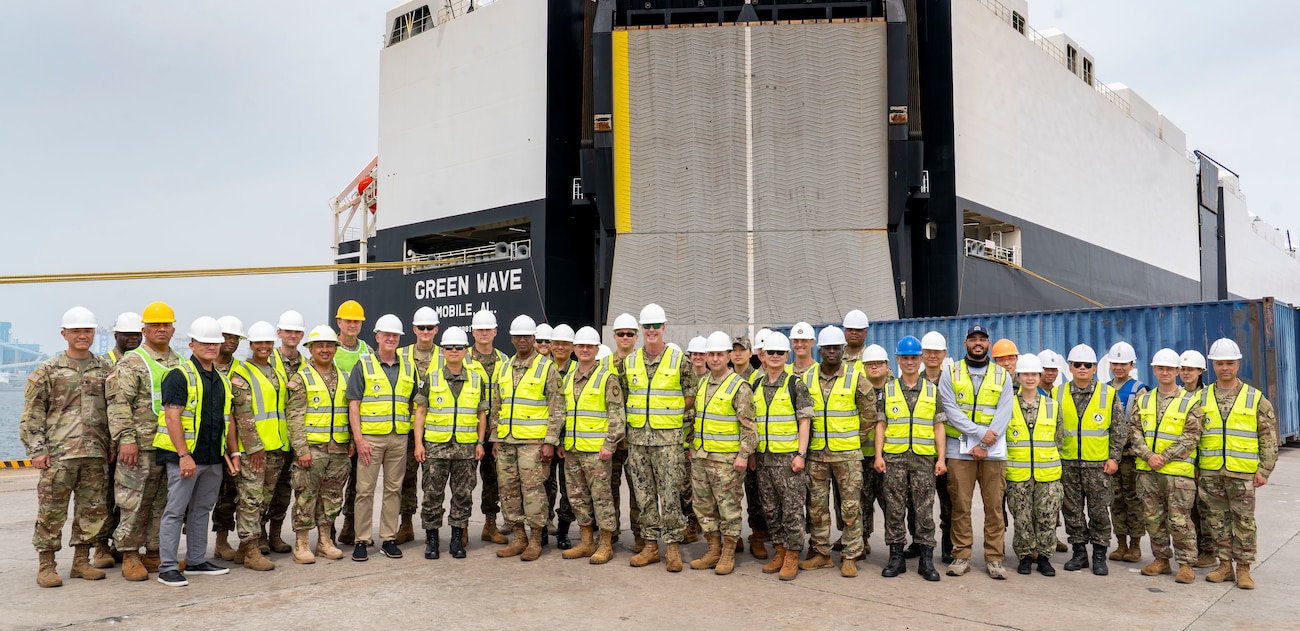 U.S. and Republic of Korea members take a group photo with Air Force Gen. Randall Reed, commander of U.S. Transportation Command, during his tour at Pyeongtaek Port, South Korea, June 10, 2025.