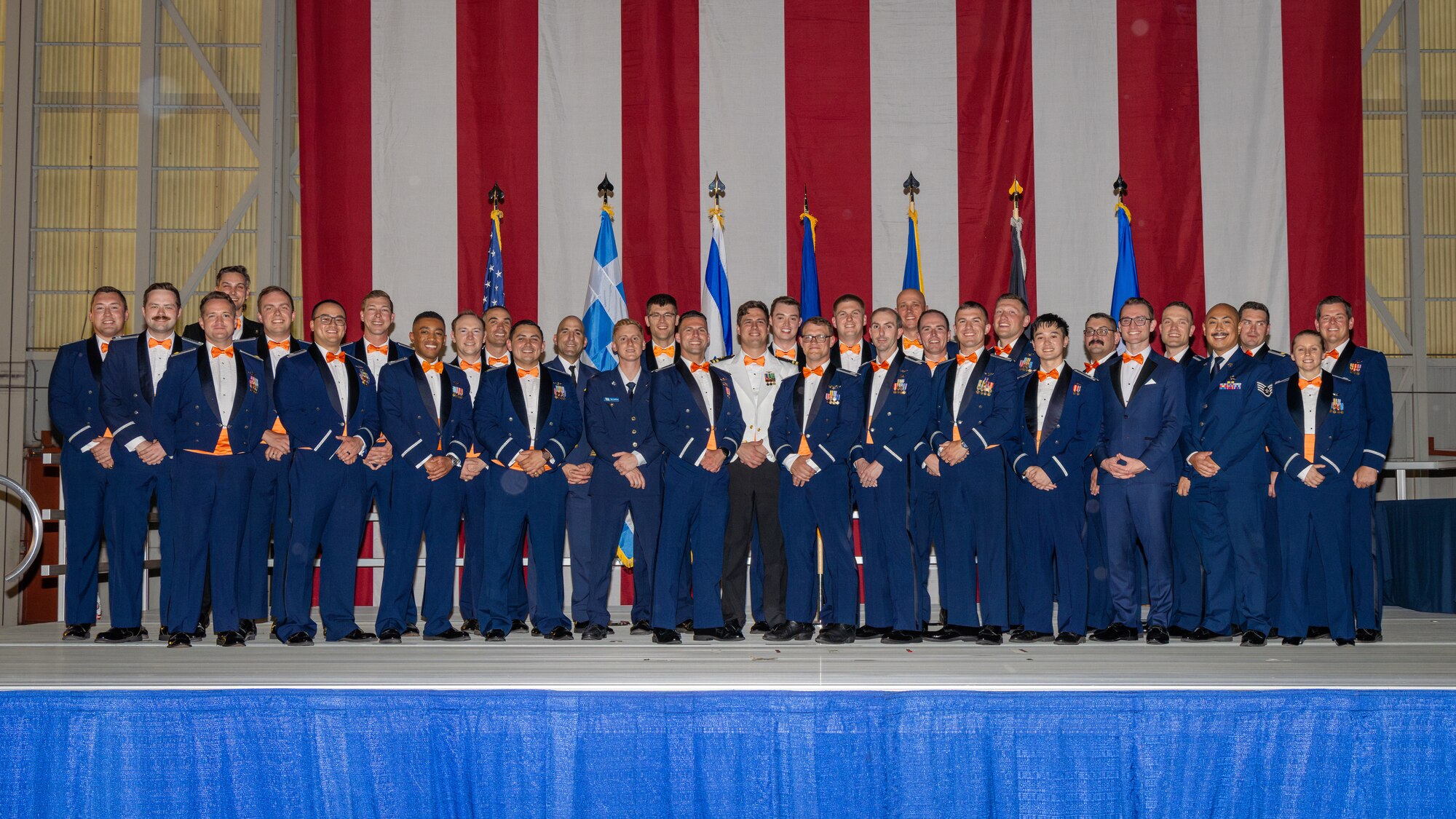 Students from Air Force Test Pilot School class 24-Bravo pose for a final class photo during graduation ceremonies held at Edwards Air Force Base, CA on June 7, 2025. Class 24B is the second fully integrated air and space course under modernized multi-domain curriculum. (Air Force photo by Brandon Herandez)