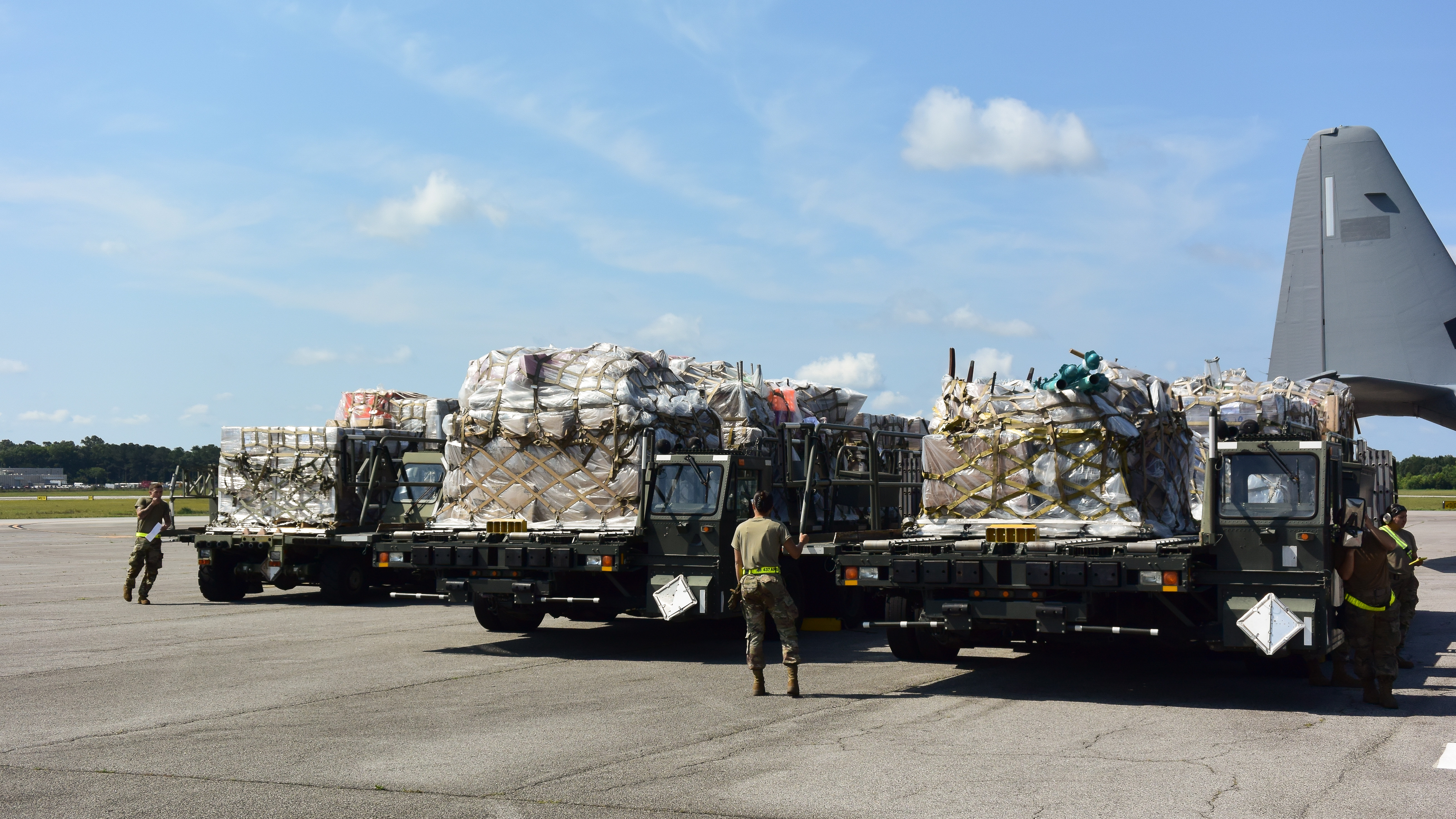 U.S. Airmen assigned to the 437th Aerial Port Squadron prepare to load humanitarian cargo onto a C-17 Globemaster III at Joint Base Charleston, South Carolina, June 6, 2025. As part of the Denton Program, a C-17 aircrew assigned to Travis Air Force Base, California, delivered approximately 55,000 pounds of humanitarian aid donated by Non-Governmental Organizations to El Salvador and Guatemala, supporting communities in need. (U.S. Air Force photo by 2nd Lt. Yasmeen Joachim Jordan)