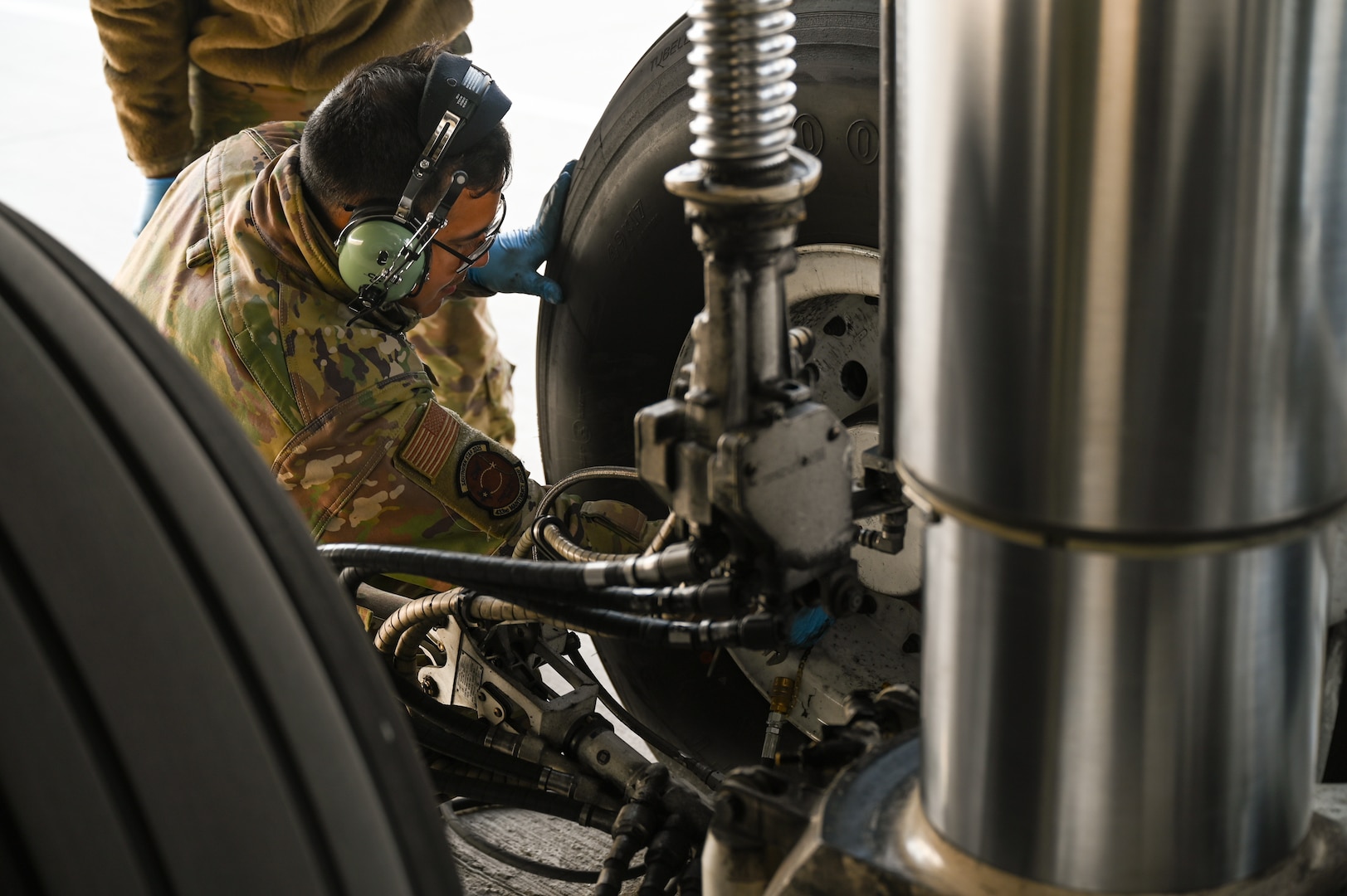 U.S. Air Force Staff Sgt. Sergio Rosas, a 433rd Aircraft Maintenance Squadron aerospace propulsion specialist, conducts pre-flight servicing on the landing gear of a C-5M Super Galaxy ahead of a sortie as part of Exercise Southern Star ‘25 at Arturo Merino Benitez International Airport in Santiago, Chile, June 4, 2025.