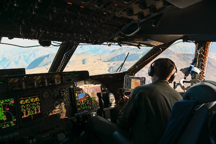 U.S. Air Force Maj. Pete Andersen, a 68th Airlift Squadron C-5M pilot, scans the terrain during a sortie as part of Exercise Southern Star ‘25 near Antofagasta, Chile, June 4, 2025.