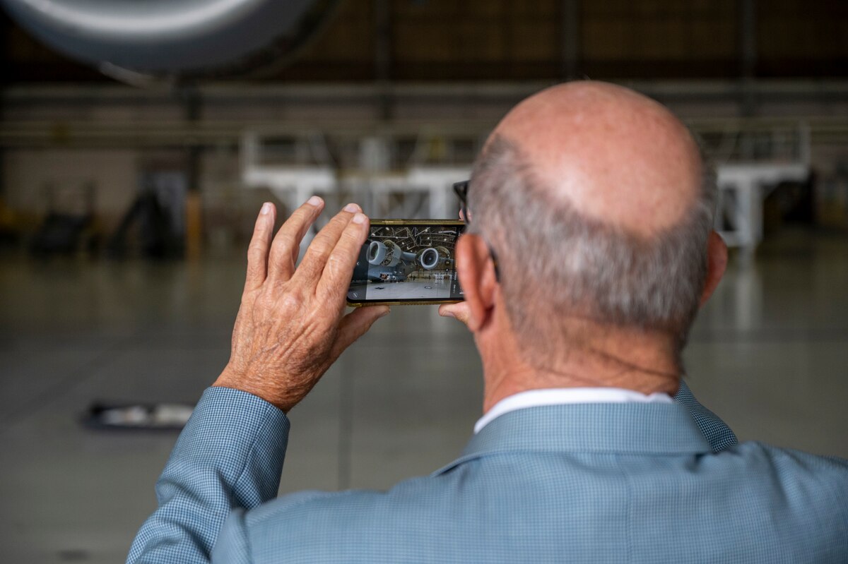 A member of the Defense Orientation Conference Association captures a photo of a C-17 Globemaster III at Joint Base Lewis-McChord, Washington, June 11, 2025.