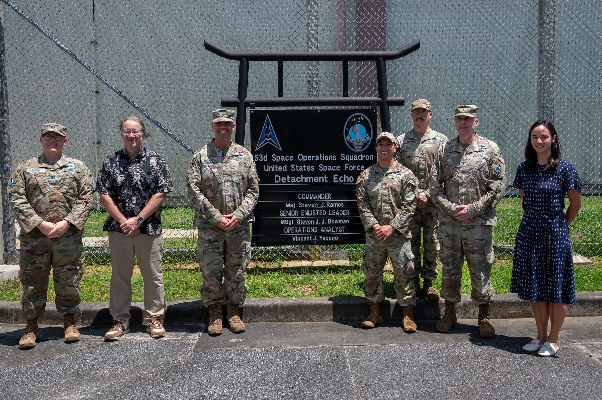 U.S. service members and civilians pose for a picture