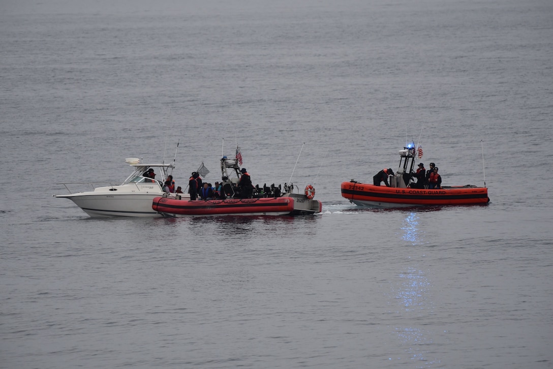 The crew of the Coast Guard Cutter Active (WMEC-618) interdicts 11 aliens aboard a 20-foot cabin cruiser boat, approximately 22 miles west of La Jolla, California, June 14, 2025. All aliens aboard were apprehended and transferred to the custody of the U.S. Border Patrol at Ballast Point. (U.S. Coast Guard courtesy photo)