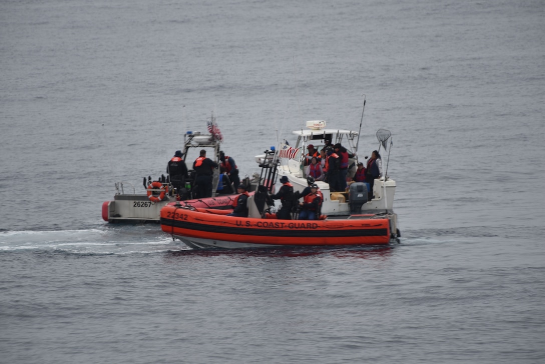 The crew of the Coast Guard Cutter Active (WMEC-618) interdicts 11 aliens aboard a 20-foot cabin cruiser boat, approximately 22 miles west of La Jolla, California, June 14, 2025. All aliens aboard were apprehended and transferred to the custody of the U.S. Border Patrol at Ballast Point. (U.S. Coast Guard courtesy photo)