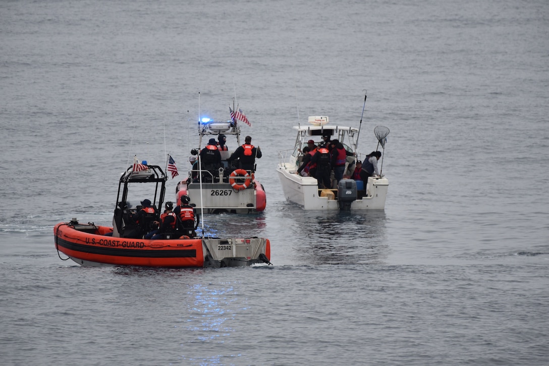 The crew of the Coast Guard Cutter Active (WMEC-618) interdicts 11 aliens aboard a 20-foot cabin cruiser boat, approximately 22 miles west of La Jolla, California, June 14, 2025. All aliens aboard were apprehended and transferred to the custody of the U.S. Border Patrol at Ballast Point. (U.S. Coast Guard courtesy photo)