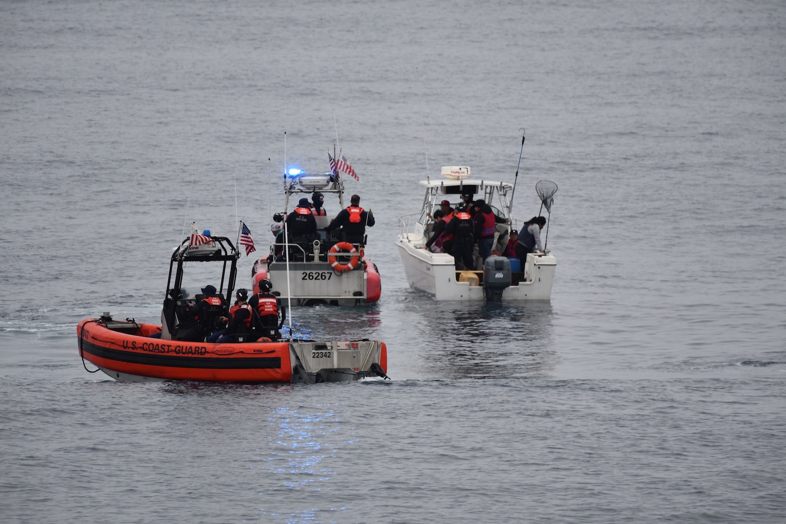 The crew of the Coast Guard Cutter Active (WMEC-618) interdicts 11 aliens aboard a 20-foot cabin cruiser boat, approximately 22 miles west of La Jolla, California, June 14, 2025. All aliens aboard were apprehended and transferred to the custody of the U.S. Border Patrol at Ballast Point. (U.S. Coast Guard courtesy photo)