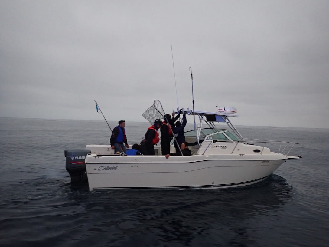 The crew of the Coast Guard Cutter Active (WMEC-618) interdicts 11 aliens aboard a 20-foot cabin cruiser boat, approximately 22 miles west of La Jolla, California, June 14, 2025. All aliens aboard were apprehended and transferred to the custody of the U.S. Border Patrol at Ballast Point. (U.S. Coast Guard courtesy photo)